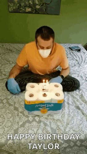 Man Wearing Mask Sitting with Toilet Paper Cake