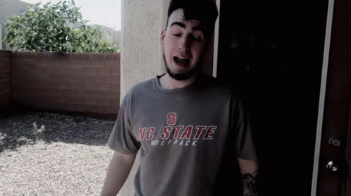Man Wearing NC State Wolfpack Shirt