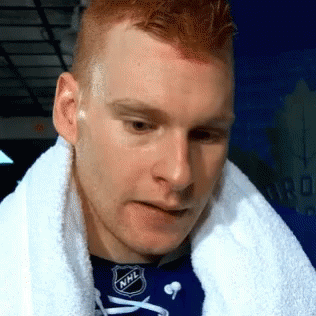 Man Wearing NHL Shirt And Towel GIF