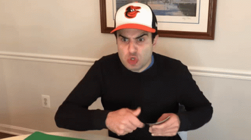 Man Wearing Orioles Hat Making Face