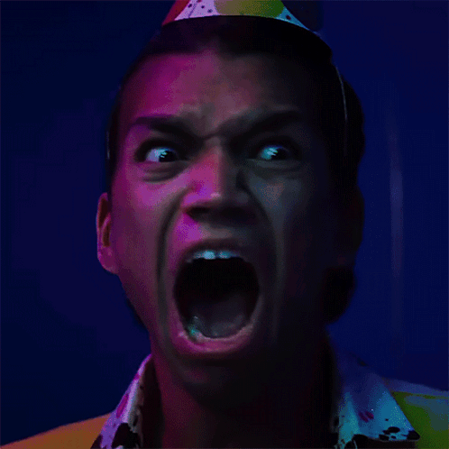 Man Wearing Party Hat with Open Mouth