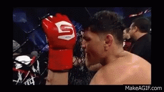 Man Wearing Red Boxing Glove with S