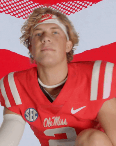Man Wearing Red Ole Miss Jersey