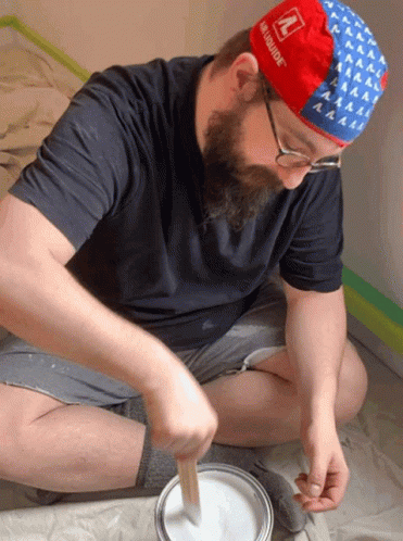 Man Wearing Red White Blue Hat with N