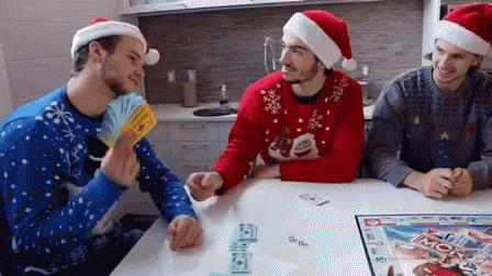 Man Wearing Santa Claus Hat Tossing Monopoly Money GIF