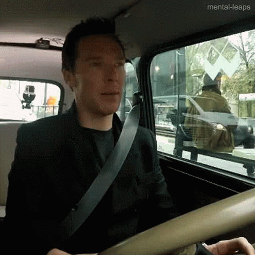 Man Wearing Seat Belt in Car