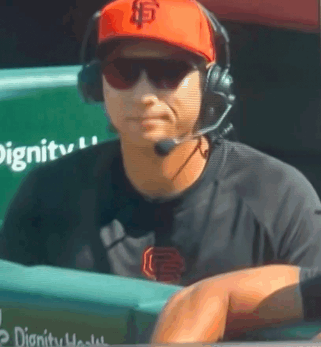 Man Wearing SF Hat and Headphones