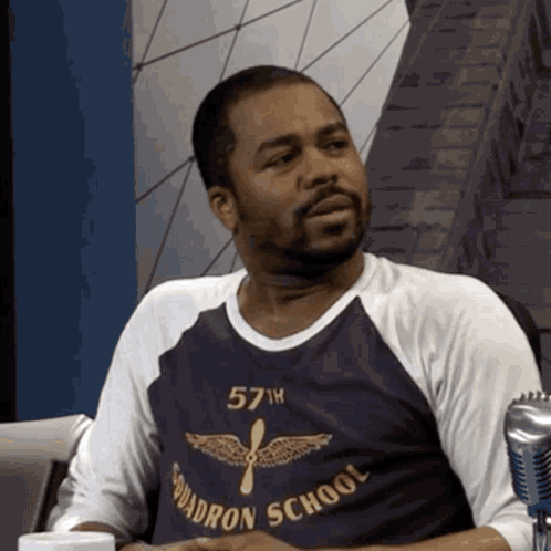 Man Wearing Squadron School Shirt