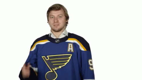 Man Wearing St Louis Blues Jersey Number 9