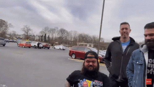 Man Wearing Stone Shirt in Parking Lot