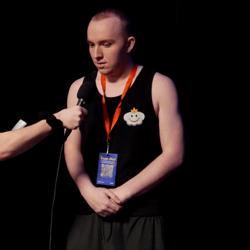 Man Wearing Stop Me Lanyard Interviewed