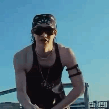 Man Wearing Sunglasses and Bandana on Roof