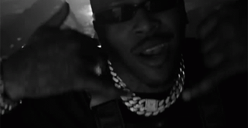 Man Wearing Sunglasses and Chain