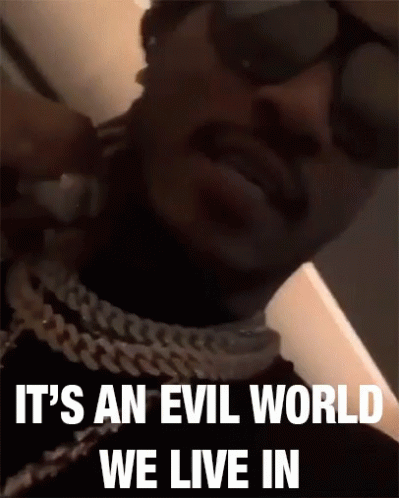 Man Wearing Sunglasses and Chain Says Evil World