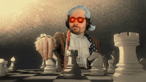 Man Wearing Sunglasses and Headphones Playing Chess