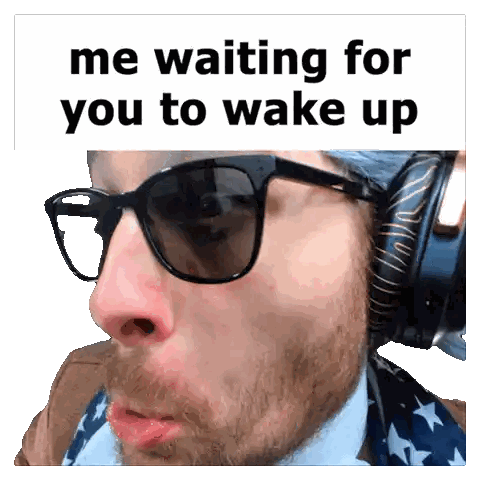 Man Wearing Sunglasses and Headphones Waiting
