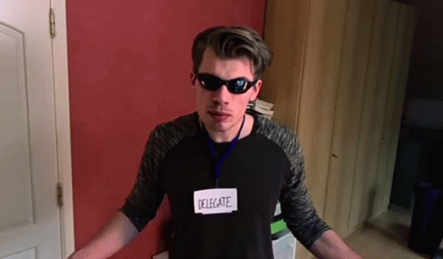 Man Wearing Sunglasses and Name Tag
