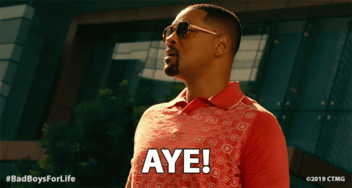 Man Wearing Sunglasses and Red Shirt With Aye