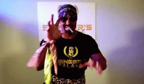 Man Wearing Sunglasses and Winged Walker Shirt