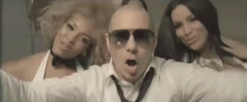 Man Wearing Sunglasses Between Two Women