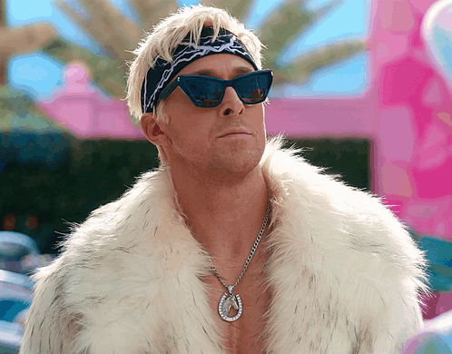Man Wearing Sunglasses Fur Coat and Horseshoe Necklace