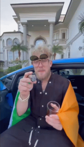 Man Wearing Sunglasses Sitting in Car