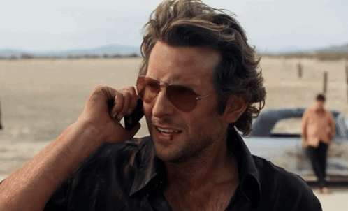 Man Wearing Sunglasses Talking on Phone