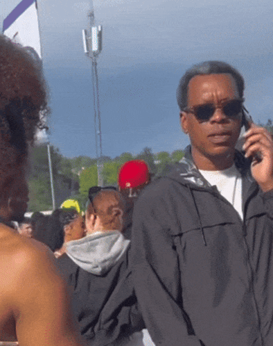 Man Wearing Sunglasses Talking on Phone