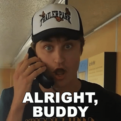 Man Wearing Trailer Park Hat Talking on Cell Phone