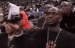 Man Wearing VR Headset In Crowd GIF