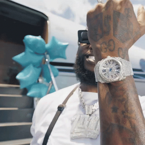 Man Wearing Watch with 99