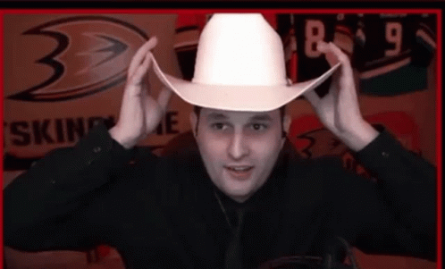 Man Wearing White Cowboy Hat with 8