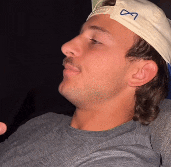 Man Wearing White Hat with Infinity Symbol