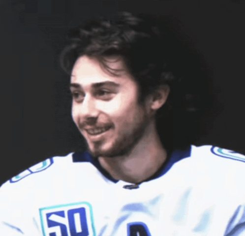 Man Wearing White Jersey Number 50