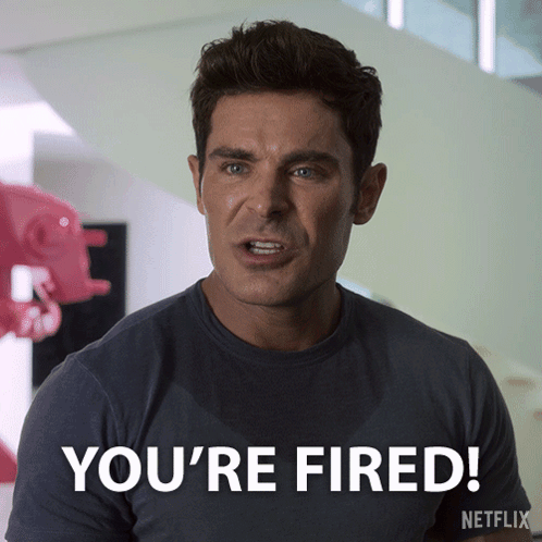 Man Wearing You're Fired T-Shirt