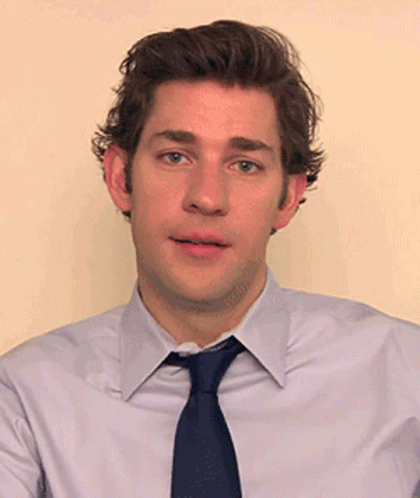 Man White Shirt Blue Tie Looking at Camera