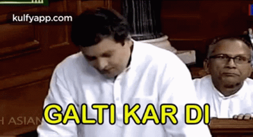 Man White Shirt Gives Foreign Speech, Another Watches GIF