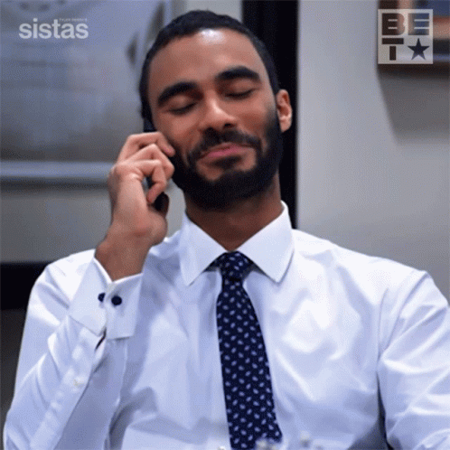 Man White Shirt Tie Talking Phone Sistas Logo GIF