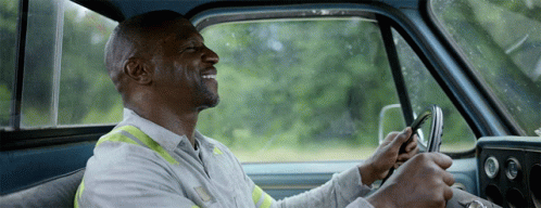 Man White Shirt Yellow Vest Driving Blue Truck