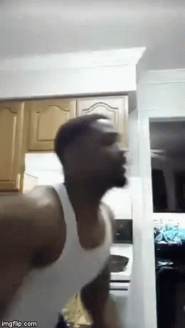 Man White Tank Top Standing Head Down Kitchen