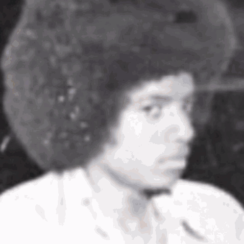 Man With Afro in White Shirt and Tie