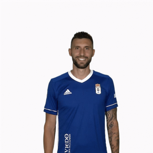Man With Arm Tattoo in Blue Adidas Shirt