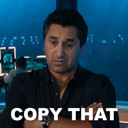 Man With Arms Crossed Says Copy That