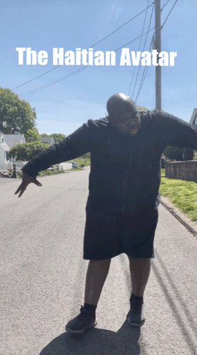 Man With Arms Outstretched on Roadside Caption The Haitian Avatar