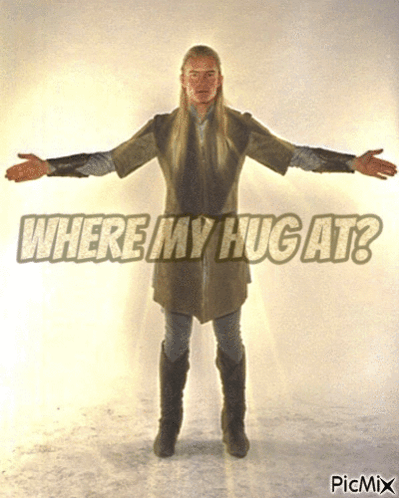 Man with Arms Outstretched Saying Where My Hug At