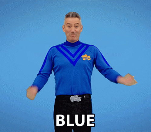 Man With Arms Outstretched Wearing Blue Shirt Saying Blue GIF