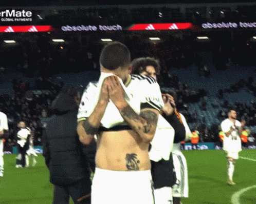 Man With Back Tattoo Lifted By Another Man GIF