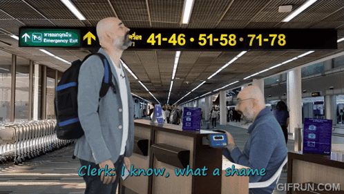 Man With Backpack in Front of Emergency Exit