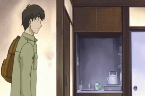 Man With Backpack In Kitchen GIF