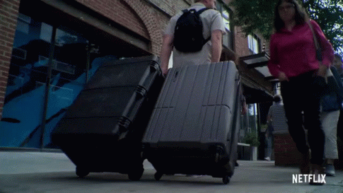 Man With Backpack Looking at Camera With Netflix Logo